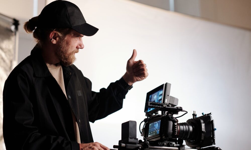 Director of production studio or crew showing thumb up gesture to his team