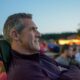 Man sitting outside at a festival